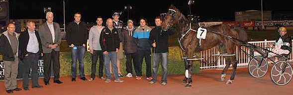 Grappa, joined by his team of supporters at Addington (Race Images photo). Grappa-group-04