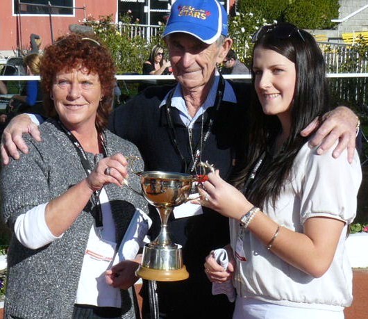 Owner Jim McDonald, daughter Michele, and grand-daughter Olivia, with the NZ Trot Oaks trophy. Trot_Oaks_with_trophy