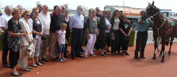 Members of the Met Five Syndicate join Western Flare after winning at Addington.