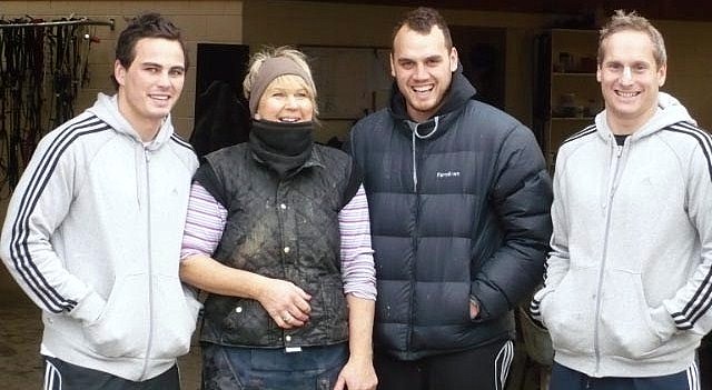 Three of last year's Crusaders rugby players, Zac Guildford (left), Israel Dagg (second from right) and Brent Ward (right), take time out for a photo with Jill Smolenski at Overport Lodge. Zac Guildford and Brent Ward are co-owners of Saskia Finn, who won at Westport on Boxing Day. p1000554